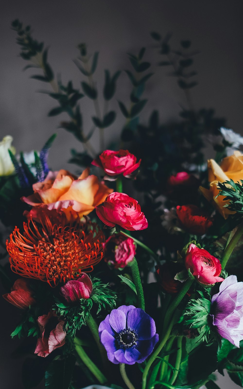 Florist arranging bouquet at Tiger Lily Flower Shop